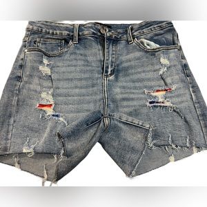 Judy Blue denim shorts with serape patches. 1X